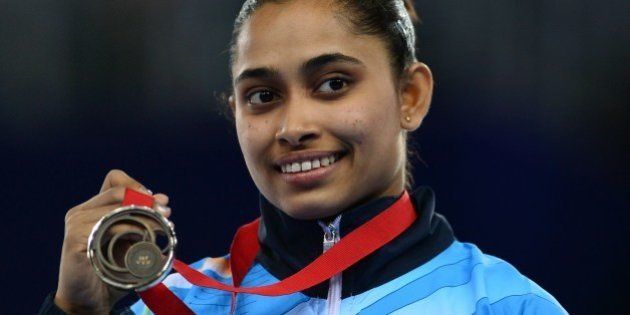 Dipa Karmakar of India poses with her medal after winning bronze in the womens vault final of the Artistic Gymnastics event during the 2014 Commonwealth Games in Glasgow, Scotland, on July 31, 2014. AFP PHOTO / CARL COURT (Photo credit should read CARL COURT/AFP/Getty Images)