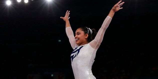 India's Dipa Karmakar reacts after a successful vault during the women's gymnastics vault apparatus final at the 2014 Commonwealth Games in Glasgow, Scotland, July 31, 2014. REUTERS/Phil Noble (BRITAIN - Tags: SPORT GYMNASTICS)