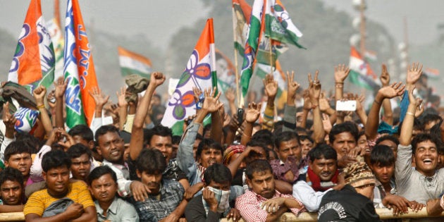 Supporters of the Chief Minister of the eastern Indian state of West Bengal and Trinamool Congress (TMC) Chief, Mamata Banerjee, attend a party's campaign rally ahead of Lok Sabha elections in Kolkata January 30, 2014. REUTERS/Rupak De Chowdhuri (INDIA - Tags: POLITICS)