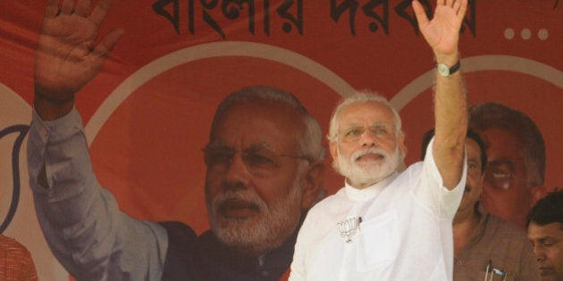 NADIA, INDIA - APRIL 17: Prime Minister Narendra Damodardas Modi wave hand to public during an election campaign rally before third phase of Assembly Election at Krishnanagar Govt. College ground, on April 17, 2016 in Nadia, India. (Photo by Samir Jana/Hindustan Times via Getty Images)