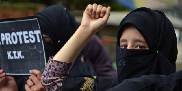 Activists from the Muslim Khawateen Markaz (MKM) take part in a protest in Srinagar on April 15, 2016 over the killing of four youths in Handwara.A protester was killed in Indian Kashmir on April 13 as angry residents clashed with police, a day after three people died when the army fired into a crowd of civilians incensed by the alleged molestation of a girl. Authorities in the restive region had imposed a partial curfew after separatist leaders called for a general strike over the deaths of two civilian protesters and a woman working in a nearby field who was hit by a stray bullet. / AFP / TAUSEEF MUSTAFA (Photo credit should read TAUSEEF MUSTAFA/AFP/Getty Images)