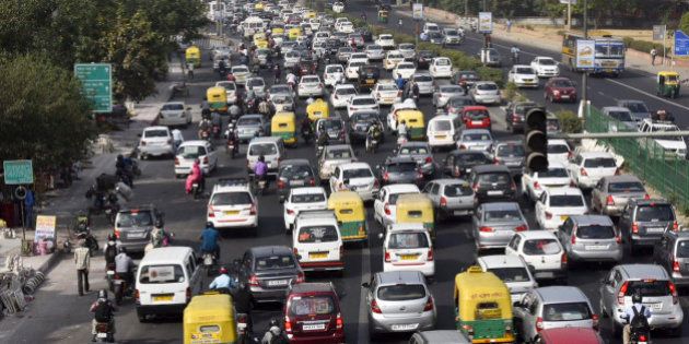 NEW DELHI, INDIA - APRIL 18: Slow traffic at NH-24 during the Odd-Even Plan on April 18, 2016 in New Delhi, India. Day four of the Delhi governments odd-even experiment began with reports of major traffic snarls emerging from various parts of the city. The second phase of the odd-even experiment was launched on April 15 to reduce the alarming levels of air pollution in the city. (Photo by Ravi Choudhary/ Hindustan Times via Getty Images)