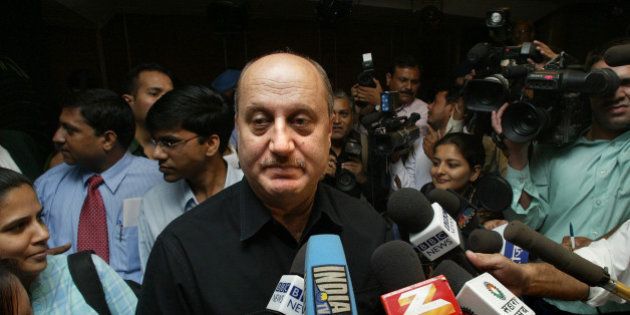 Bollywood actor and ousted chairman of the Central Board of Film Certification Anupam Kher talks at a press conference in New Delhi, India, Thursday, Oct. 14, 2004. The federal government appointed former Bollywood actress Sharmila Tagore as chairperson on Oct. 13, according to media reports. (AP Photo/Sebastian John)
