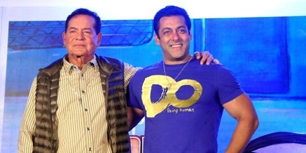 Indian Bollywood actor Salman Khan (R) and screenwriter Salim Khan pose for a photograph during a promotional event for the Hindi film 'Bajrangi Bhaijaan' directed by Kabir Khan in Mumbai on July 16, 2015. AFP PHOTO / STR (Photo credit should read STRDEL/AFP/Getty Images)