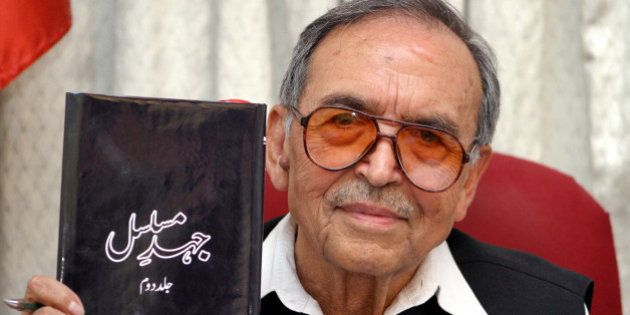 Amanullah Khan, chief of the Jammu and Kashmir Liberation Front (JKLF), holds his autobiography