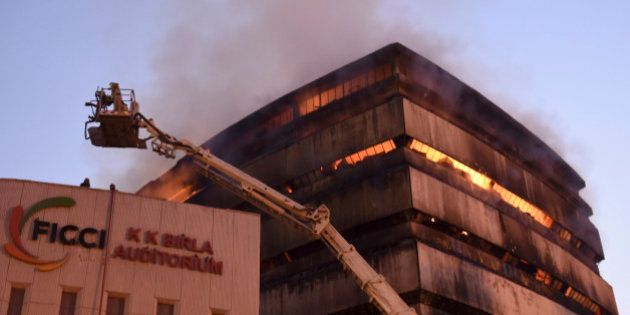 NEW DELHI, INDIA - APRIL 26: The National Museum of Natural History is seen engulfed in fire at Mandi house on April 26, 2016 in New Delhi. The fire started in the early hours of Tuesday. As many as 25 fire tenders were pressed into service to contain the flames. Two fireman have been injured while tackling the fire. (Photo by Arvind Yadav/ Hindustan Times via Getty Images)