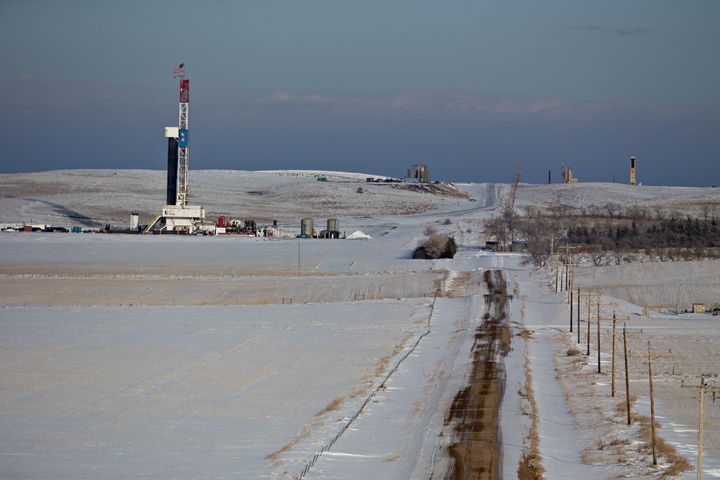 An American flag flies on top of a Unit Drilling Co. rig in the Bakken Formation outside Watford City, North Dakota. 