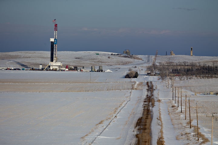 An American flag flies on top of a Unit Drilling Co. rig in the Bakken Formation outside Watford City, North Dakota.