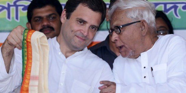 Congress vice-president Rahul Gandhi (L) and veteran Communist leader and former West Bengal chief minister Buddhadeb Bhattacharjee talk onstage during a joint rally between Congress and the Left Front political party in Kolkata on April 27, 2016. This is the first time rivals Congress and the Left Front have come together to campaign against the ruling Trinamool Congress in West Bengal's ongoing State assembly elections. / AFP / Dibyangshu SARKAR (Photo credit should read DIBYANGSHU SARKAR/AFP/Getty Images)