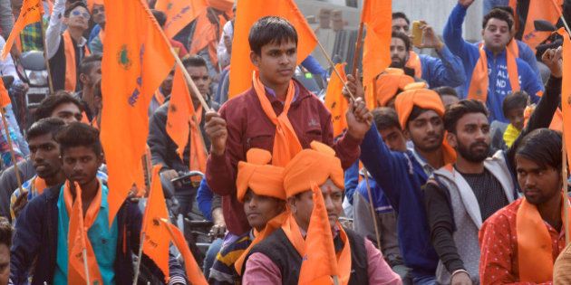 Indian activists of Hindu Bajrang Dal, along with Vishva Hindu Parishad (VHP) organizations, raise religious slogans during a procession marking the 23rd anniversary of the demolition of the Babri Masjid Mosque in Ayodhya, in Amritsar on December 6, 2015. Hindu hardliners demolished the Babri Mosque on December 6, 1992, claiming it was built on the site of the birth place of the Hindu God Ram, sparking off country wide Hindu-Muslim riots. AFP PHOTO / NARINDER NANU / AFP / NARINDER NANU (Photo credit should read NARINDER NANU/AFP/Getty Images)