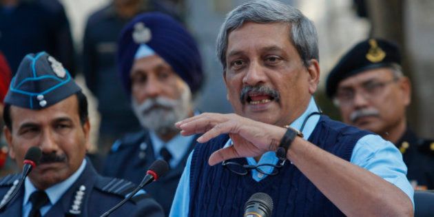 Indian Defense Minister Manohar Parrikar addresses the media at the Indian air force base in Pathankot, India, Tuesday, Jan.5, 2016. Indian forces have killed the last of the six militants who attacked the air force base near the Pakistan border over the weekend, the defense minister said Tuesday, though soldiers were still searching the base as a precaution. (AP Photo/Channi Anand)