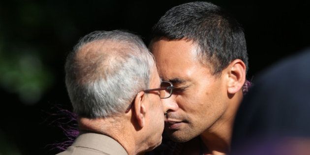 Indian President Pranab Mukherjee (C) is greeted with a Hongi, a traditional Maori greeting, during a welcoming ceremony at Government House in Auckland on April 30, 2016. Mukherjee is in New Zealand for a three-day official visit. / AFP / MICHAEL BRADLEY (Photo credit should read MICHAEL BRADLEY/AFP/Getty Images)