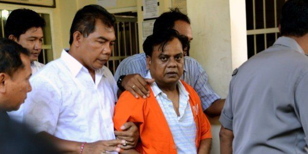 Indian national Rajendra Sadashiv Nikalje, 55, known in India as Chhota Rajan, is brought out from a holding cell at the Bali police headquarters in Denpasar on Bali island on November 2, 2015. An alleged Indian crime boss wanted in his home country for up to 20 murders has been arrested in Indonesia after two decades on the run, police said October 26. Nikalje had been evading police in several countries for years, with Interpol flagging him as a wanted man back in 1995. AFP PHOTO / SONNY TUMBELAKA (Photo credit should read SONNY TUMBELAKA/AFP/Getty Images)