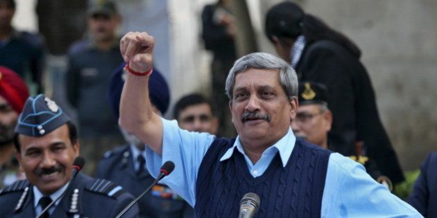 India's Defence Minister Manohar Parrikar gestures during a news conference as India's Air Chief Marshal Arup Raha (L) watches at the Indian Air Force (IAF) base at Pathankot in Punjab, India, January 5, 2016. Six militants who attacked an Indian air base have been confirmed killed, Parrikar said on Tuesday, adding that a four-day-old operation to secure the compound was still under way. REUTERS/Mukesh Gupta