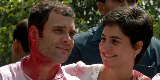 Rahul Gandhi (L) and his sister Priyanka Gandhi celebrate in the northern Indian city of Rae Bareli May 11, 2006. Rahul and Priyanka are children of Sonia Gandhi, the head of India's ruling Congress party. Indian communist parties took early leads on Thursday as votes were counted after polls for five state assemblies, the biggest electoral test of the ruling congress party since it came to power two years ago. REUTERS/Pawan Kumar
