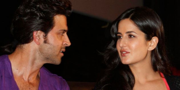 Bollywood actor Hrithik Roshan (L) speaks with Katrina Kaif during a promotional event for their forthcoming movie