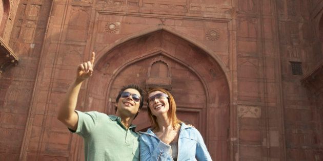 Couple admiring Red Fort, Delhi, India