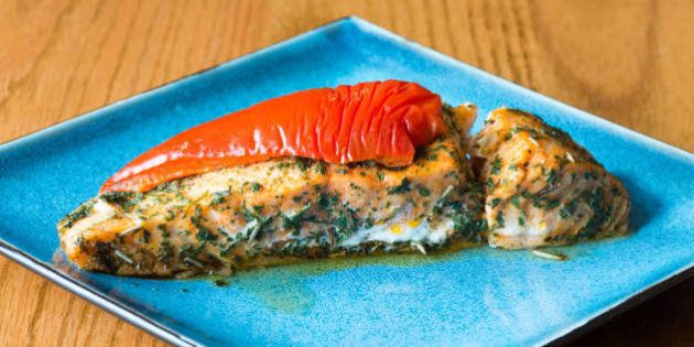 TORONTO, ONTARIO, CANADA - 2016/04/22: Canadian cuisine: salmon stuffed with cheese, marinated with herbs and garnished with red pepper. (Photo by Roberto Machado Noa/LightRocket via Getty Images)