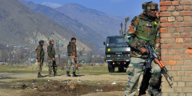 PULWAMA, INDIA - 2016/02/21: Indian army soldiers stand alert near the encounter site in Pampore. Six persons were killed including three CRPF soldiers, two Indian army captains and a civilian when suspected militants attacked a military convoy on Srinagar National high way near Pampore. the militants then took refuge in a nearby government building Where a gun battle between government forces and militants is underway, police said. (Photo by Faisal Khan/Pacific Press/LightRocket via Getty Images)
