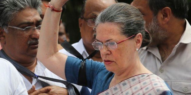 Indiaâs opposition Congress party president Sonia Gandhi, centre, leads other Congress party lawmakers during a protest in the parliament premises, in New Delhi, India, Tuesday, Aug. 4, 2015. Tuesdayâs protest followed after the speaker of India's Parliament on Monday barred 25 opposition legislators from its sessions for the rest of the week for causing