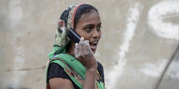 An Indian woman speaks on a mobile phone in Suraj village in Mehsana district, some 100 km from Ahmedabad, on February 20, 2016. A village in Indian Prime Minister Narendra Modi's home state of Gujarat has banned single women from using mobile phones, with elders deeming the technology a 'nuisance to society'. AFP PHOTO / Sam PANTHAKY / AFP / SAM PANTHAKY (Photo credit should read SAM PANTHAKY/AFP/Getty Images)