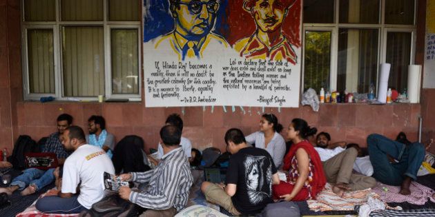 NEW DELHI, INDIA - MAY 3: JNU students on day six of hunger strike protesting punishment given to them by the university authorities on May 3, 2016 in New Delhi, India. Representatives of both factions are sitting on a hunger strike. Students with Left affiliations are on a hunger strike protesting punishment given to them by the university authorities for the February 9 event held to commemorate Parliament attack convict Afzal Guru. Anti-national slogans were allegedly raised at the event. Students of the ABVP faction are on a hunger strike demanding the punishment against students be made more stringent. (Photo by Vipin Kumar/Hindustan Times via Getty Images)
