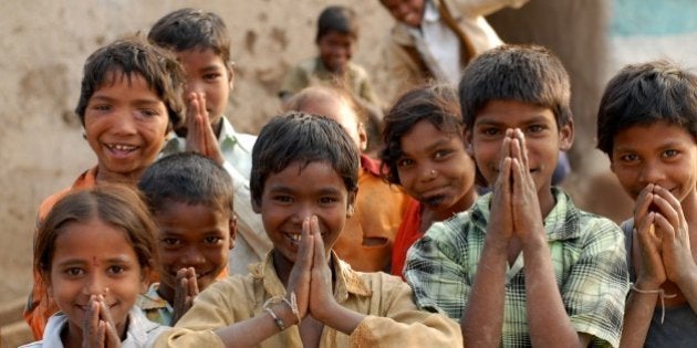 India: Children in a village near Nagpur, Maharashtra, doing 'Namaste' which is a form of welcome or greeting. Jan 29, 2007. (Photo by: Majority World/UIG via Getty Images)