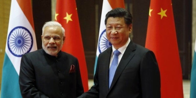 India's Prime Minister Narendra Modi (L) and China's President Xi Jinping shake hands before they hold a meeting in Xian, in China's Shaanxi province, on May 14, 2015. Modi began a three-day trip to China on May 14 by inspecting the Terracotta Warriors as a festering border dispute colours relations between the Asian giants. AFP PHOTO / POOL / Kim Kyung-Hoon (Photo credit should read KIM KYUNG-HOON/AFP/Getty Images)