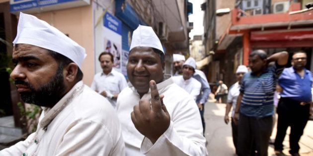 NEW DELHI, INDIA - MAY 15: AAP leader Imran Husain shows his ink marked finger after casting vote during Delhi Municipal bypolls, on May 15, 2016 in New Delhi, India. Voting began on Sunday morning for the Delhi Municipal bypolls to 13 wards in a triangular contest being considered the litmus test ahead of the 2017 civic body elections. Over six lakh electorates are eligible to decide the fate of 95 candidates. The polls would witness a three-way contest between the Aam Aadmi Party (AAP), the Bharatiya Janata Party (BJP) and the Congress. The results of the by-polls would be declared on May 17. (Photo by Arun Sharma/Hindustan Times via Getty Images)