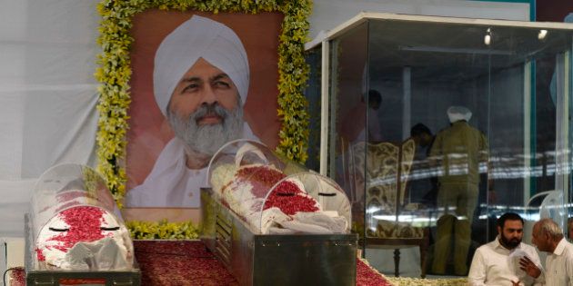 NEW DELHI, INDIA - MAY 16: Mortal remains of Baba Hardev Singh, spiritual leader of the Sant Nirankari Mission, and his son-in-law Avneet Setya placed at Nirankari Sant Samagam Ground Burari for the devotees to pay their final respects on May 16, 2016 in New Delhi, India. Baba Hardev Singh, chief priest of the Nirankari sect, was killed in a car accident in Canada's Montreal. Baba Hardev Singh was travelling from New York to Montreal in a car along with his two sons-in-law Avneet and Sunny when the car crash happened. (Photo by Vipin Kumar/Hindustan Times via Getty Images)