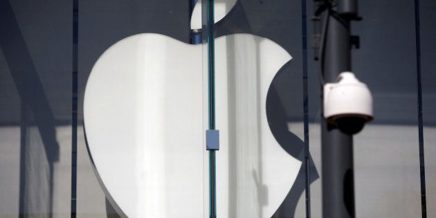 The logo of Dow Jones Industrial Average stock market index listed company Apple (AAPL) is seen next to a security camera in Santa Monica, California, United States, April 12, 2016. REUTERS/Lucy Nicholson