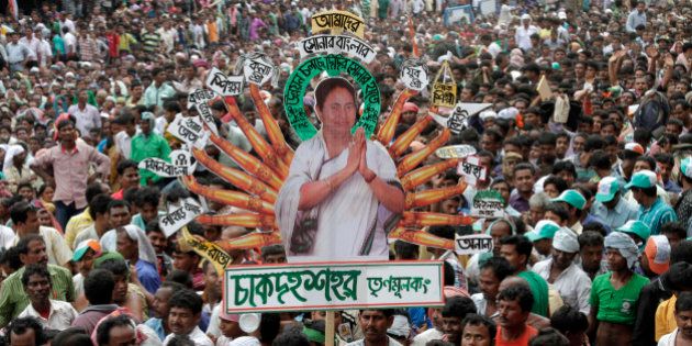 Indian West Bengal stateâs Trinamool Congress party (TMC) supporters carry a cutout of their leader and state chief minister Mamata Banerjee comparing her with Hindu Goddess Durga with development schemes displayed on each hand, during an event in Kolkata, India, Tuesday, July 21, 2015. The event was held in memory of fourteen Congress party supporters who were killed in police firing during an agitation against the then ruling Left Front government on this day in 1993, described by the West Bengal state as Martyrâs Day. The TMC was founded in 1998 after it broke away from the Congress party. Poster reads,