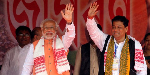 India's main opposition Bharatiya Janata Party (BJP) prime ministerial candidate Narendra Modi, left, and the partyâs Assam state President Sarbananda Sonowal wave to the crowd during an election campaign rally in Nagaon, in the northeastern Indian state of Assam, Saturday, April 19, 2014. As India, Asia's third-largest economy, holds elections that will gauge the mood of millions of new voters, Modi's Hindu nationalist party is proclaiming the economic success of Gujarat, the western state he's led for more than decade. Critics, however, question whether the extra wealth has translated into better lives for the stateâs 60 million people. (AP Photo/Anupam Nath)