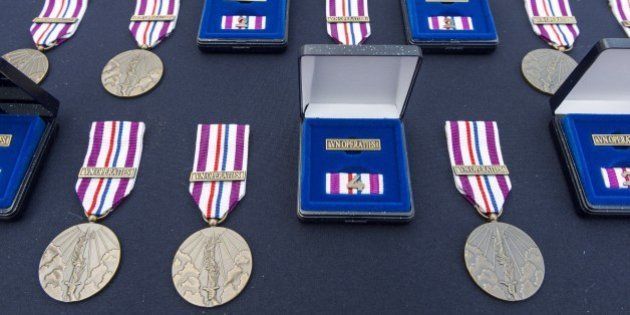 Commemorative peace operation medals, awarded to soldiers of the Royal Netherlands Army for their contribution to the United Nations (UN) mission in Mali, are pictured ahead of an awarding ceremony at the Van Braam Houckgeest station in Doorn, The Netherlands, on September 25, 2015. AFP / ANP / LEX VAN LIESHOUT +++ NETHERLANDS OUT (Photo credit should read LEX VAN LIESHOUT/AFP/Getty Images)