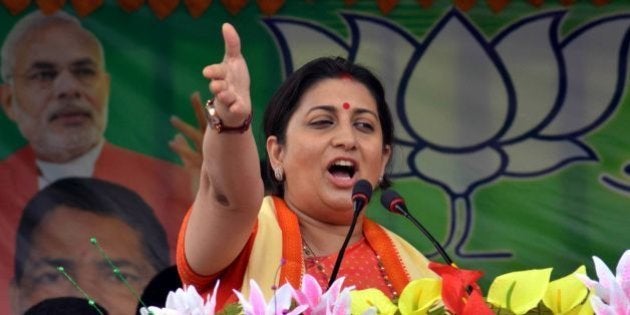 Indian Minister for Human Resource Development Smriti Irani addresses party workers during a Bharatiya Janata Party (BJP) election campaign rally ahead of state assembly elections for Assam in Karimganj on March 30, 2016. Thousands of Indian voters will elect legislators for the 126 seats contested in 25,000 polling stations in the north-eastern state of Assam in two phases on April 4 and 11. / AFP / ARINDAM DEY (Photo credit should read ARINDAM DEY/AFP/Getty Images)