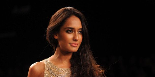 Indian Bollywood actress Lisa Haydon showcases a creation by Monica & Karishma on the third day of the Lakme Fashion Week (LFW) summer/resort 2014 in Mumbai on March 13, 2014. AFP PHOTO/STR (Photo credit should read STRDEL/AFP/Getty Images)