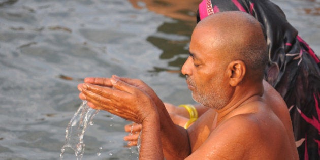 UJJAIN, INDIA - MAY 21: Pilgrims take a holy dip in Shipra River on the third and the last 'shahi snan' (royal bath) of month-long Simhastha Kumbh Mela, on May 21, 2016 in Ujjain, India. The Ujjain Kumbh is one of the four fairs traditionally recognized as Kumbha Melas. It is celebrated when Jupiter ascends into sun sign Leo's quarter or the Simha constellation of zodiac, which is why it is called 'Simhastha'. Ujjain is also the seat of divine Mahakal, the Lord of all times. Simhastha 2016 begins on 22nd of April and will continue till 21st of May. (Photo by Shankar Mourya/Hindustan Times via Getty Images)