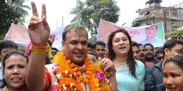 Indian candidate Himanta Biswa Sarma (2nd L) of the BJP is accompanied by supporters on the way to file nomination papers from Jalukbari Assembly Constituency in Guwahati on March 21 2016. Thousands of Indian voters will elect legislators for the 126 seats contested in 25,000 polling stations in Assam state in two phases on April 4th and 11th. / AFP / Biju BORO (Photo credit should read BIJU BORO/AFP/Getty Images)