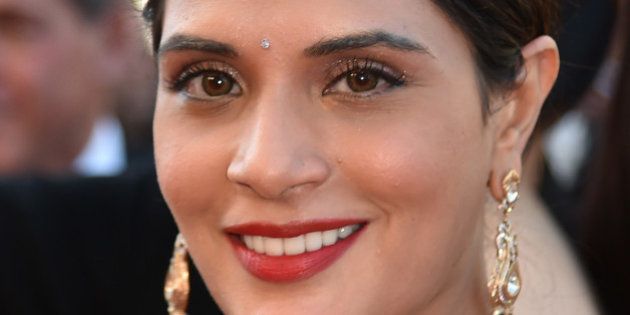 Indian actress Richa Chadha smiles as she arrives on May 15, 2016 for the screening of the film 'Mal de Pierres (From the Land of the Moon)' at the 69th Cannes Film Festival in Cannes, southern France. / AFP / ALBERTO PIZZOLI (Photo credit should read ALBERTO PIZZOLI/AFP/Getty Images)