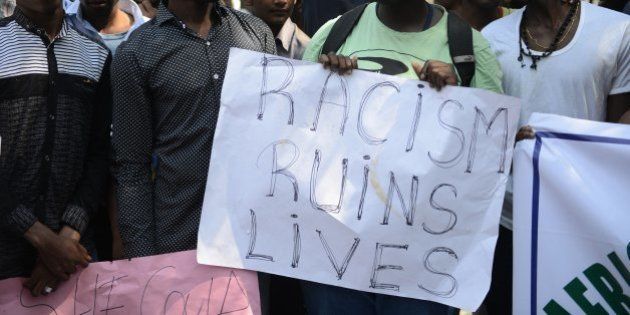 Members of the African Students Association hold placards during a protest in Hyderabad on February 6, 2016, in support of Tanzanian nationals assaulted by a local mob in Bangalore. Indian authorities suspended two policemen and made four more arrests over a mob attack on a Tanzanian student in Bangalore, police said February 5, in a case that has caused widespread outrage. AFP PHOTO / Noah SEELAM / AFP / NOAH SEELAM (Photo credit should read NOAH SEELAM/AFP/Getty Images)