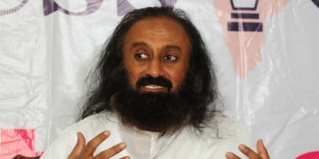 BHOPAL, INDIA - NOVEMBER 22: Art of Living founder Sri Sri Ravi Shankar addresses media on November 22, 2015 in Bhopal, India. Ravi Shankar said that there should be intolerance against rising pollution and injustice. On Paris terror attack, he also said that âIndia has been suffering due to terrorism since long, but the Western countries were unable to accept it.â (Photo by Mujeeb Faruqui/ Hindustan Times via Getty Images)