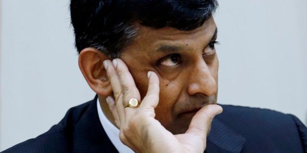 Reserve Bank of India Governor Raghuram Rajan takes a question from a journalist during a press conference in Mumbai, India, Tuesday, Aug. 5, 2014. India's central bank says it sees signs of recovery in Asia's third-largest economy even though the monsoon season, which is crucial for agriculture, had a weak start. (AP Photo/Rajanish Kakade)