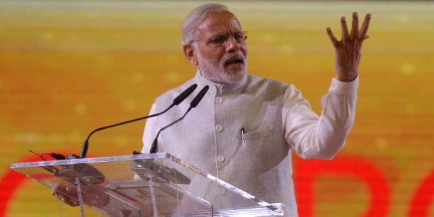 Indian Prime Minister Narendra Modi delivers a public speech to a crowd of mostly Indian nationals at the Singapore Expo, Tuesday, Nov. 24, 2015 in Singapore. Modi is on a two-day official visit to the city-state. (AP Photo/Joseph Nair)