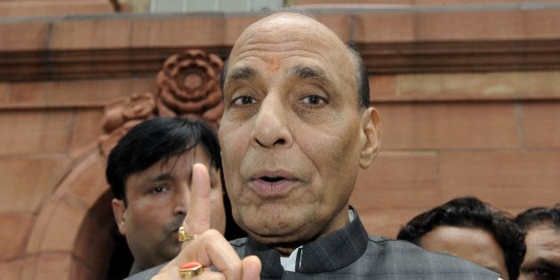 NEW DELHI, INDIA - AUGUST 6: Union Home Minister Rajnath Singh talking with media persons after attending the Parliament Monsoon Session on August 6, 2015 in New Delhi, India. The Lok Sabha passed a bill providing for filing of cheque bounce cases at the places where it is presented. (Photo By Sonu Mehta/Hindustan Times via Getty Images)