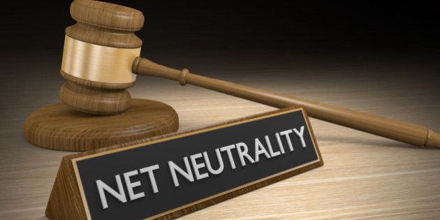Data equality concept of a wooden court gavel next to a sign that says net neutrality,