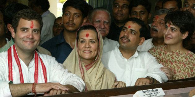 Sonia Gandhi (2nd L), president of India's main opposition Congress party, smiles after she filed her nomination papers as her son Rahul Gandhi (L), son-in-law Robert Vadra (2nd R), daughter Priyanka Vadra (R) and party supporters look on in Rae Bareli, in the northern Indian state of Uttar Pradesh, April 6, 2004. Gandhi's are contesting two seats in the state. The national elections in India, in which more than 675 million people are eligible to vote, will be held in five phases between April 20 to May 10. REUTERS/Kamal Kishore KK/AH/TW