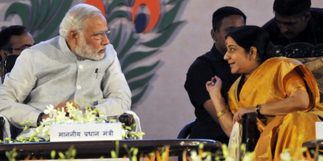 BHOPAL, INDIA - SEPTEMBER 10: Prime Minister Narendra Modi having a word with External Affairs Minister Sushma Swaraj during the inauguration of the 10th World Hindi Conference on September 10, 2015 in Bhopal, India. Around 2,000 participants from India and 27 countries are expected to attend the 10th edition of the Vishwa Hindi Sammelan, being held on September 10-12 in Bhopal. (Photo by Praveen Bajpai/Hindustan Times via Getty Images)