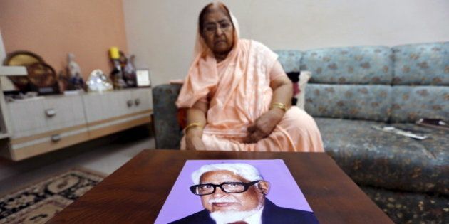 Zakia Jafri shows a photograph of her late husband Ehsan Jafri, a lawmaker for the Congress party which now sits in opposition, who was hacked to death by a Hindu mob in riots, inside her son's house in Surat, India, September 15, 2015. Jafri, a frail 76-year-old, has begun what may be the last legal battle to pin blame on Indian Prime Minister Narendra Modi for deadly riots that shook the state of Gujarat when he was chief minister, and claimed her husband's life. Picture taken September 15, 2015. REUTERS/Amit Dave TPX IMAGES OF THE DAY
