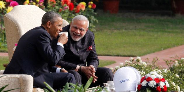 U.S. President Barack Obama and India's Prime Minister Narendra Modi (R) talk as they have coffee and tea together in the gardens of Hyderabad House in New Delhi January 25, 2015. REUTERS/Jim Bourg/File Photo