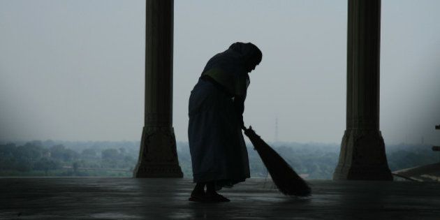 This is a photograph of a lone sweeper cleaning the floors of Agra Fort. Who knows what she is thinking as she assumes her daily chores surrounded by such tranquil settings